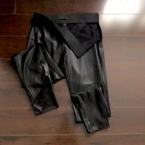 Long leather pants with zippers on the legs